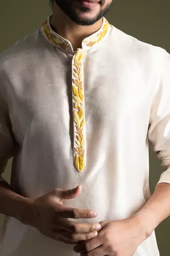 Cream asymmetric cut silk kurta with cream pants