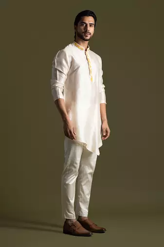 Cream asymmetric cut silk kurta with cream pants