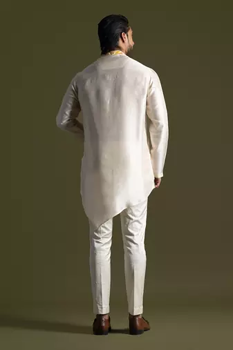 Cream asymmetric cut silk kurta with cream pants