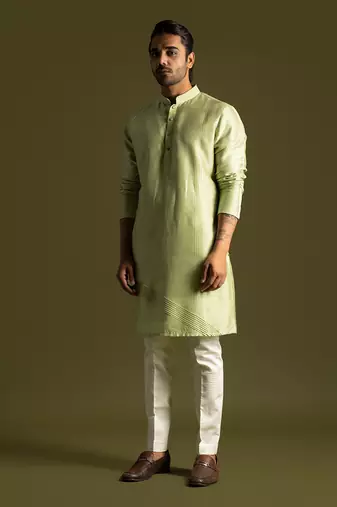 Pistachio green silk kurta with cream pants