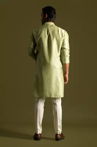 Pistachio green silk kurta with cream pants