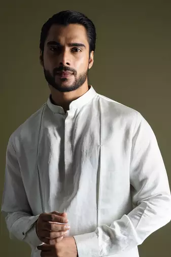 Ice blue symmetric drape kurta cream pants