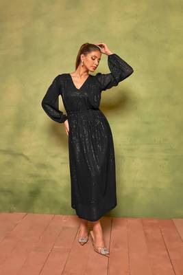 Rich black sequin pleated dress for effortless nights. 1