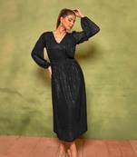 Rich black sequin pleated dress for effortless nights.