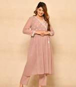 Angrakha style gathered kurta set with print and embroidery details paired with pants