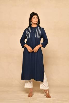 Straight kurta with pintucks and embroidery details paired with straight rayon pant. 1