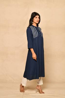 Straight kurta with pintucks and embroidery details paired with straight rayon pant. 2
