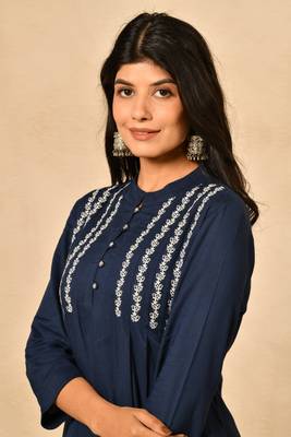 Straight kurta with pintucks and embroidery details paired with straight rayon pant. 3