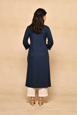 Straight kurta with pintucks and embroidery details paired with straight rayon pant. 4