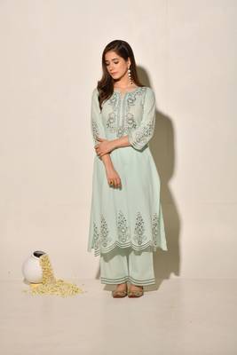 A-line cotton kurta set with embroidery details, cutwork details, paired up with pants. 1