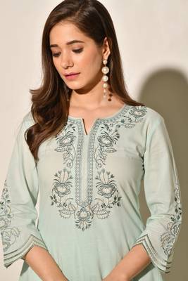 A-line cotton kurta set with embroidery details, cutwork details, paired up with pants. 3
