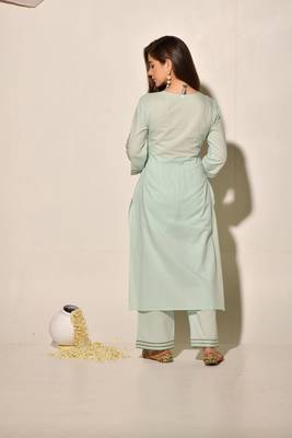 A-line cotton kurta set with embroidery details, cutwork details, paired up with pants. 4