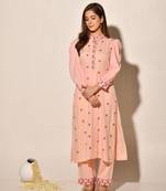 A-line kurta set with embroidery details, puffed full sleeves paired up with pant and dupatta.