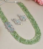 Peridot layered necklace with ad brooch and earrings