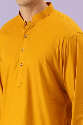 Yellow plain cotton short kurta with churidar traditional look