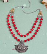 Layered statement beads necklace with silver plated pendant