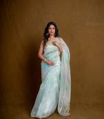 Sea green floral play organza saree with blouse