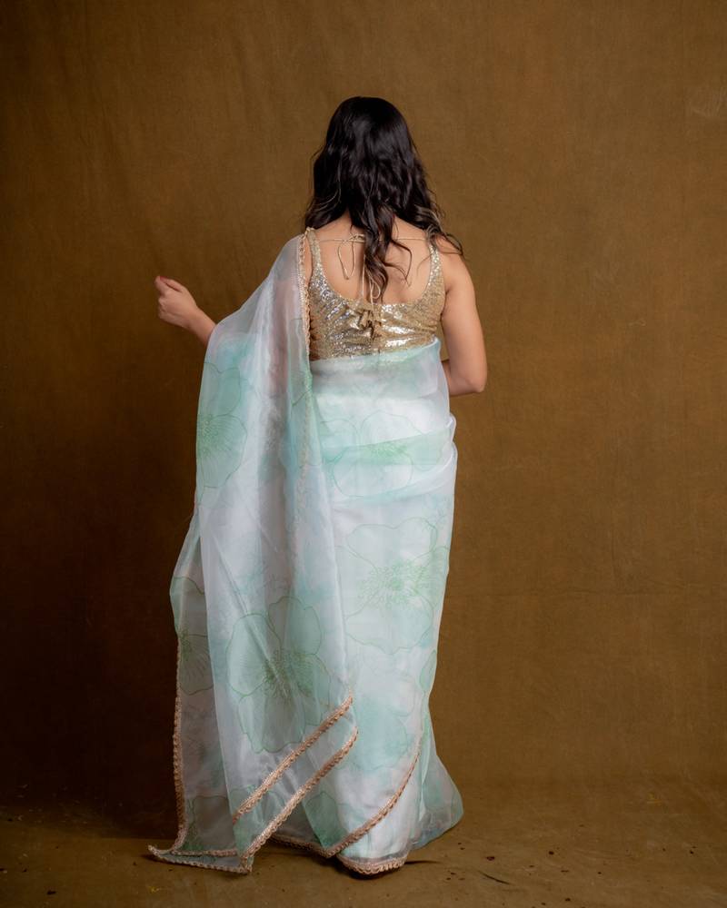 Sea green floral play organza saree with blouse