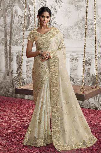 Off white silk heavy thread embroidred with sequince work saree with blouse