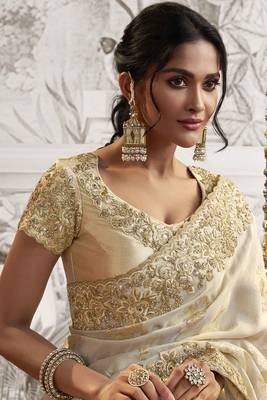 Off white silk heavy thread embroidred with sequince work saree with blouse 2
