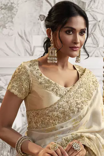 Off white silk heavy thread embroidred with sequince work saree with blouse
