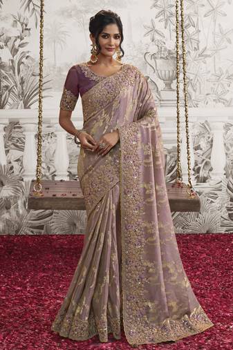 Light mauve silk heavy thread embroidred with sequince work saree with blouse