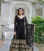 faux blooming  captivating black color gown with ravishing dupatta