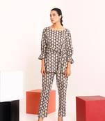 Brown tie up detailed paisley patterned top  paired with pants