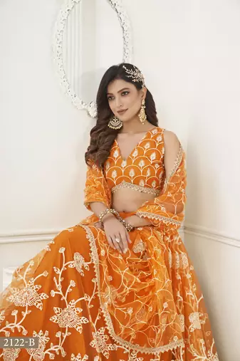 WOMEN'S ORANGE BUTTERFLY NET WITH SEQUINS AND embroidered LEHENGA CHOLI FOR WEDDING
