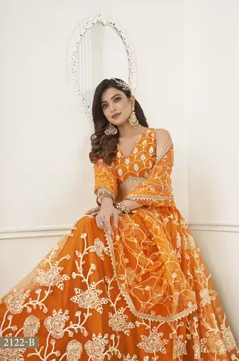 WOMEN'S ORANGE BUTTERFLY NET WITH SEQUINS AND embroidered LEHENGA CHOLI FOR WEDDING