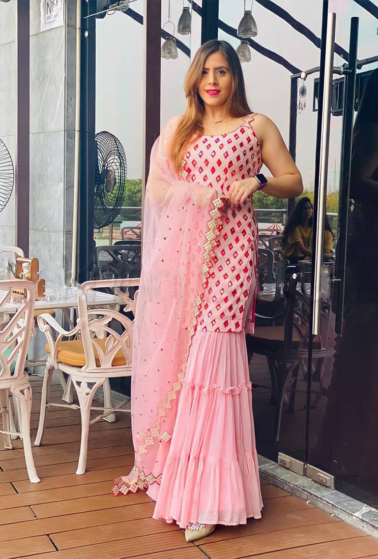 Captivating baby pink faux georgette multi layered sharara suit semi stitched