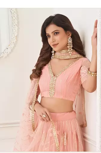 Peach Heavy Embroidery Net Semi Stitch A Line Lehenga With Blouse