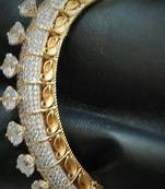 Diamond bangle with single line engraved solitaire