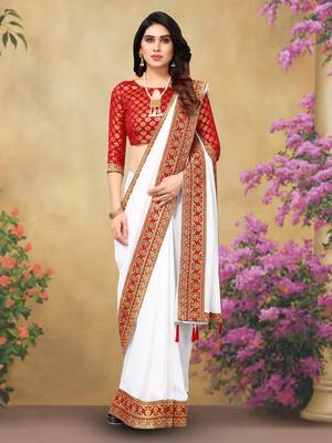 White Vichitra Silk Blend Saree With Fancy Lace And Jacquard Blouse Piece. 1