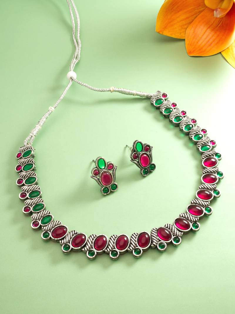 Pink and green color stone studded necklace set with par of matching earrings