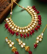 Gold plated kundan stone studded jewellery set with pair of earring and mangtikka