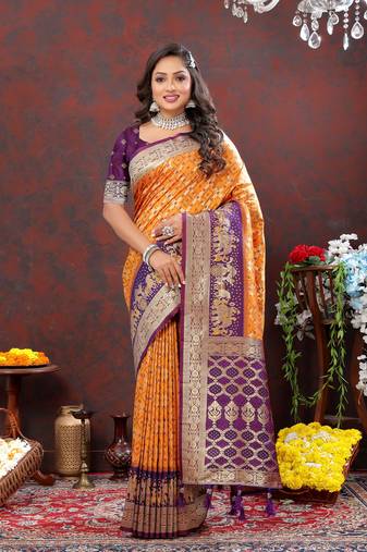 Charming Orange Soft Patola Silk Blend Saree With Meenakari Weaving Motifs And Rich Zari Weaving Pallu