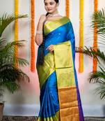Blue bangalore silk saree with lime green mahapaar border and woven motifs