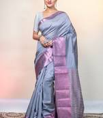 Grey kanjivaram soft silk saree with pink stripe pallu and woven motifs