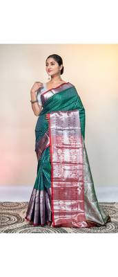 kanjivaram saree in green color with silver zari woven motifs and border 1