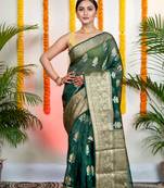 Green organza silk saree with zari border and floral motifs