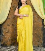 Yellow embroidered crepe saree with embroidered lace border