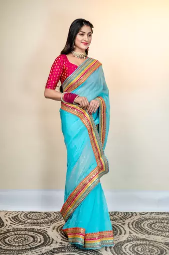 Maya blue organza saree with multicolor border