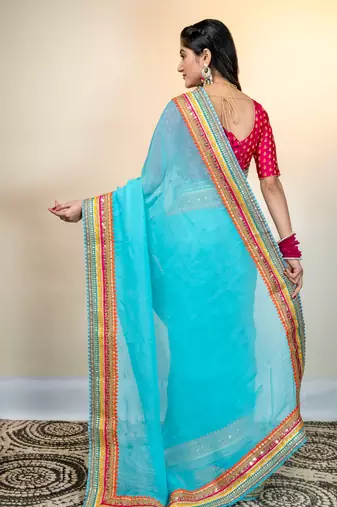 Maya blue organza saree with multicolor border