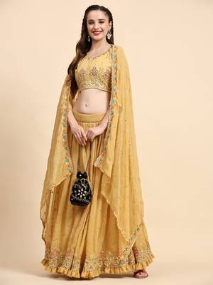 Yellow Sequine Embroidered Faux Georgette Fabric flared Lehenga Choli with Dupatta. 1