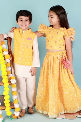 Yellow printed nehru jacket and white kurta pyjama set