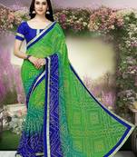 Green  printed faux georgette saree with blouse