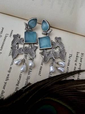 Silver toned german silver floral earring 1