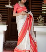 White to red ombre soft silk saree with , rich pallu, and cotton tassels. paired with a soft red woven blouse.