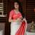 White to red ombre soft silk saree with , rich pallu, and cotton tassels. paired with a soft red woven blouse.